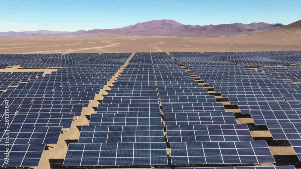 Aerial footage hundreds solar energy modules or panels rows along the ...