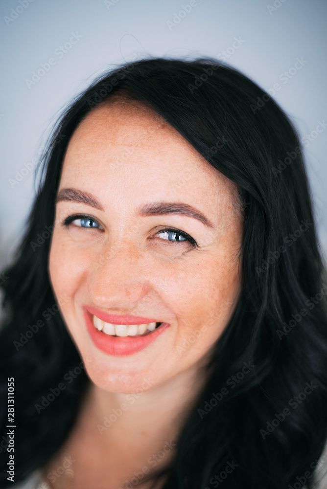 Portrait of brunette girl without retouching, visible skin problems Portrait of brunette girl without retouching, visible skin problems