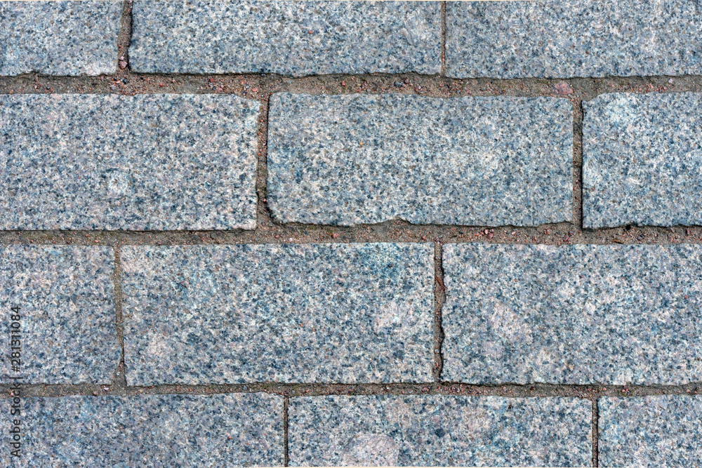 Naklejka premium Texture of the wall and gray granite bricks.
