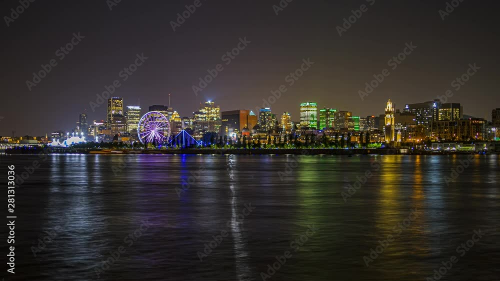 Night time lapse of Montreal old port with the Saint Lawrence river and a ferris wheel, Zoom out Night time lapse of Montreal old port with the Saint Lawrence river and a ferris wheel, Zoom out