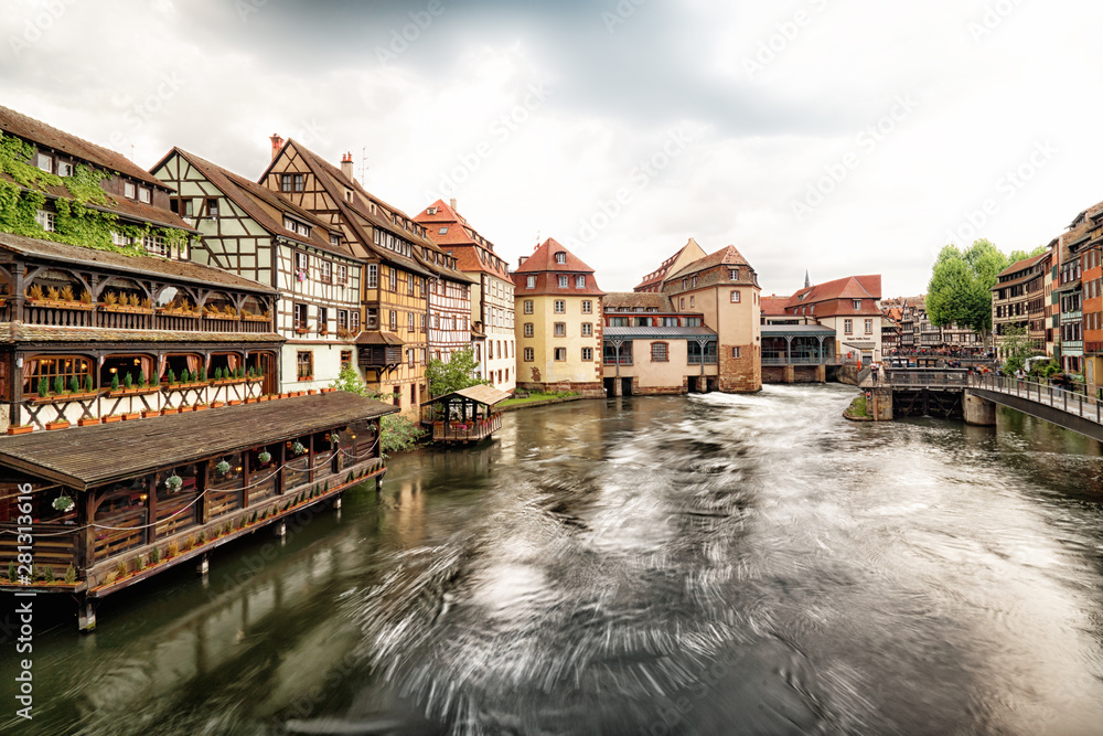 View of the Saint Martin bridge in the Petite France district of Strasbourg, Alsace, France . Long exposure photo View of the Saint Martin bridge in the Petite France district of Strasbourg, Alsace, France . Long exposure photo