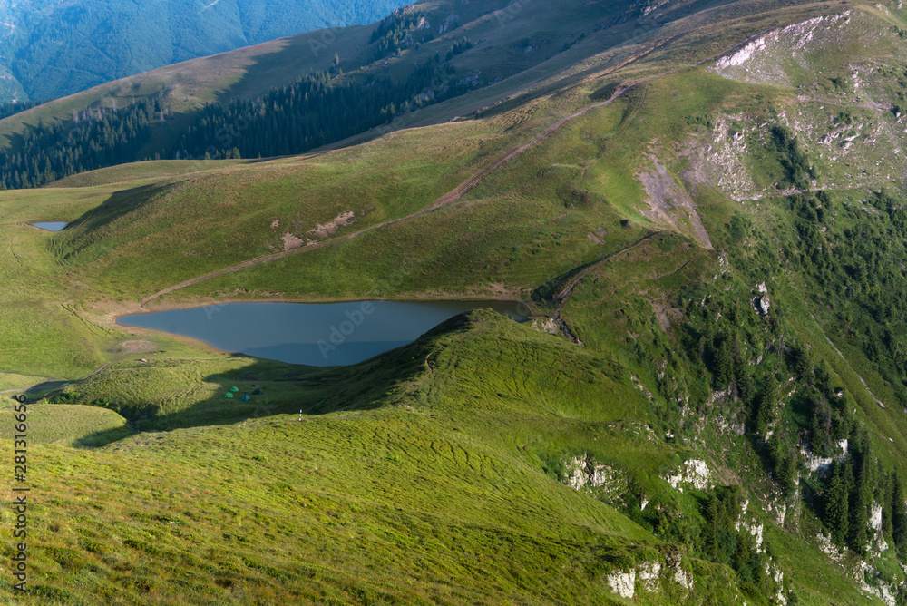 Landscape of wonderful glacier Vinderel Lake. Mountain Maramures Nature Park. Natural reserve. Carpathian. Romania. Europe.