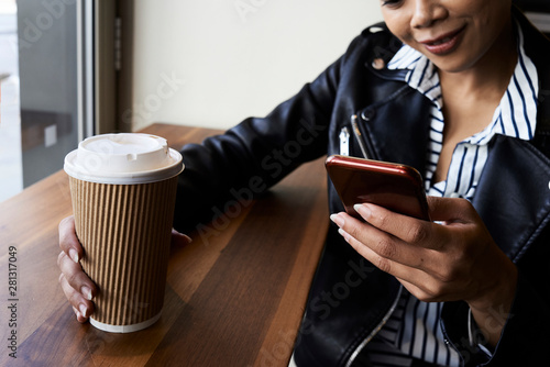 Asian girl having cup of coffee. photo