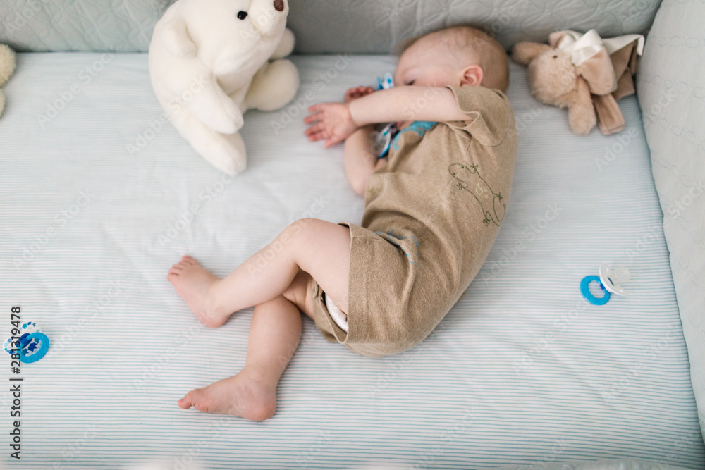 baby napping in a crib Stock Photo Adobe Stock