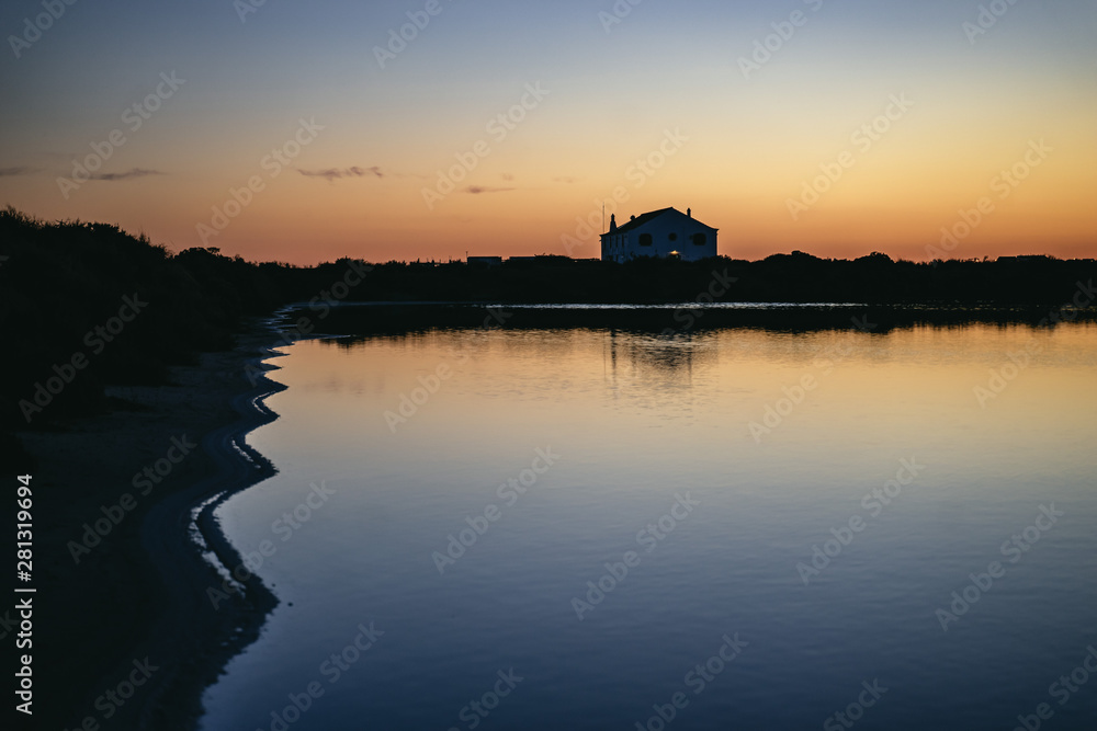 Reflections on the water at sunset at Faro Airport