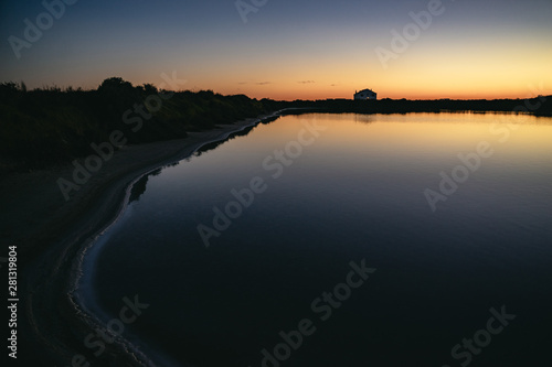 Sunset at Faros Airport with silhouetted buildings