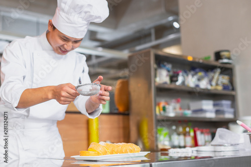 one chef working in kitchen photo