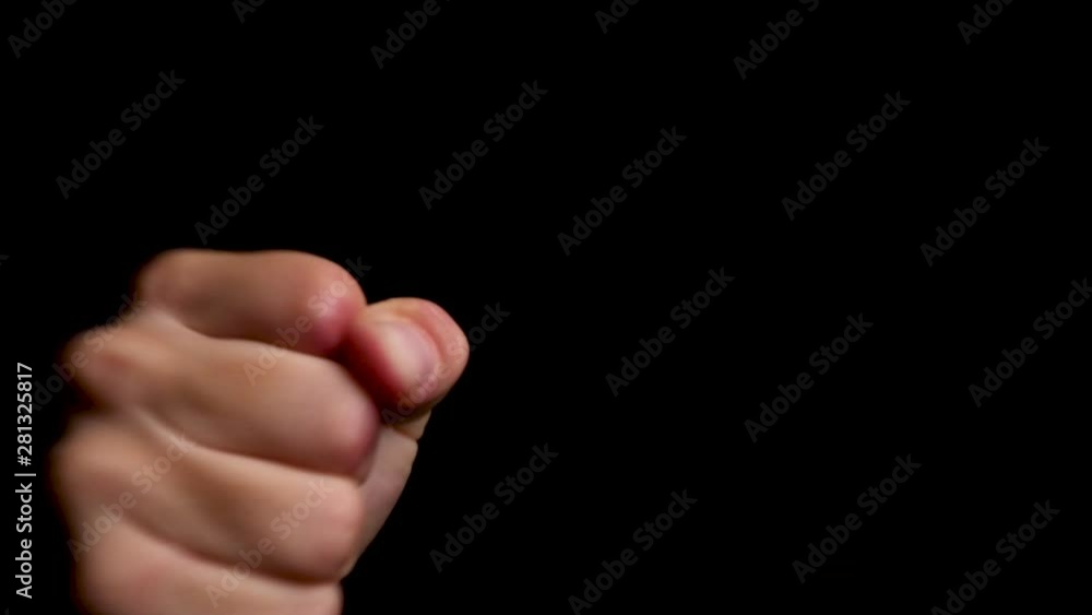 Male man hands punching aggressively close to the camera lens, close up Male man hands punching aggressively close to the camera lens, close up