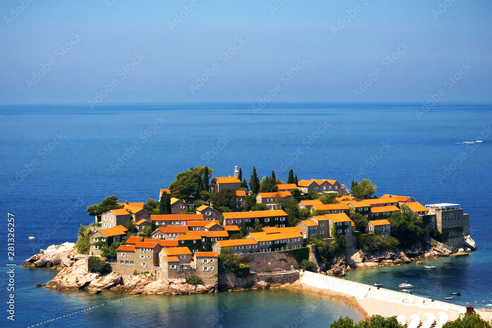Sveti Stefan island in Budva in a beautiful summer day, Montenegro. Adriatic sea, Montenegro, Europe. Beautiful world of Mediterranean countries. Traveling concept background.