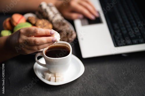 Sugar addiction  unhealthy lifestyle  weight gain  dietary  healthcare and medical concept. Woman pouring huge amount of sugar into coffee cup and eating sugary food