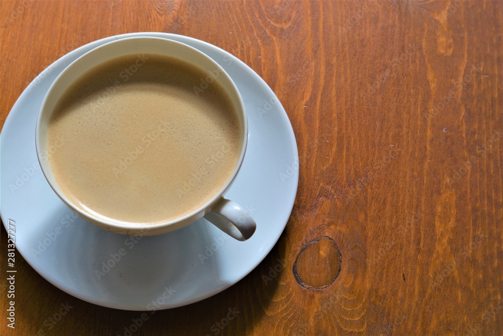 cup of hot cappuccino coffee on wooden table cup of hot cappuccino coffee on wooden table