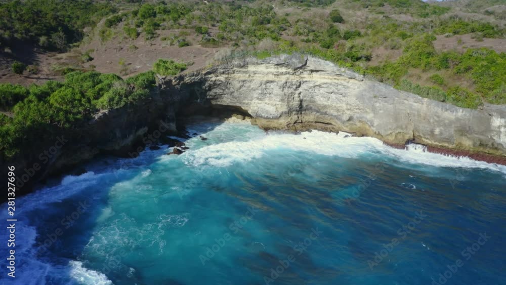 Pull Back Revealing Shot of Blue Lagoon Penida at Nusa Penida, Bali - Indonesia Pull Back Revealing Shot of Blue Lagoon Penida at Nusa Penida, Bali - Indonesia