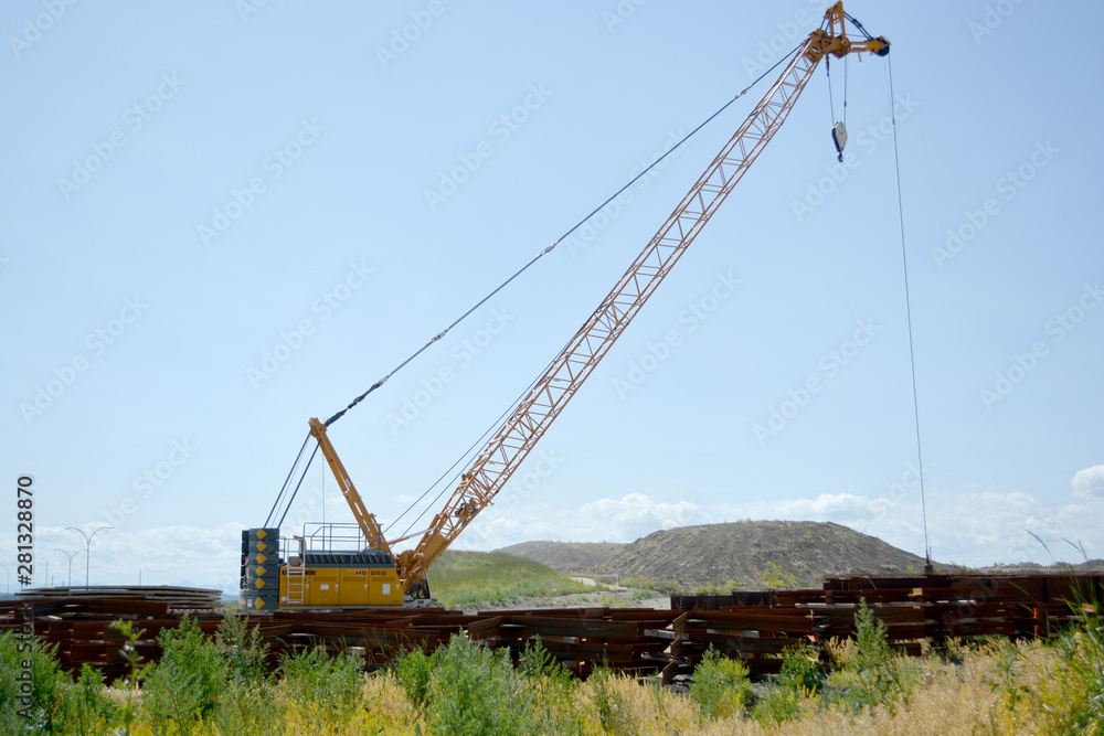 Crane equipment working on highway construction site Crane equipment working on highway construction site