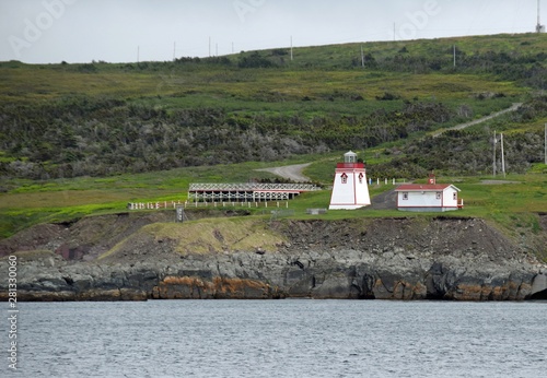 Bild auf Leinwand view across the ocean towards the red and white Fortune Head Lighthouse; Burin P