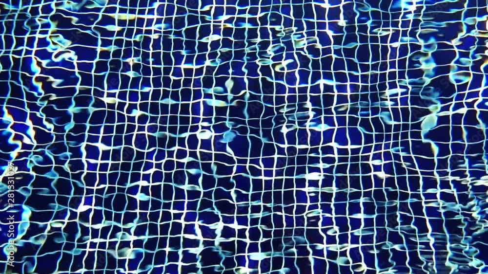 Close-up Shot Of Pool Water features a close-up shot of the clear blue waters of a swimming pool. It appears like the video was taken on a sunny day and the pool looks clean and soothing. Close-up Shot Of Pool Water features a close-up shot of the clear blue waters of a swimming pool. It appears like the video was taken on a sunny day and the pool looks clean and soothing.