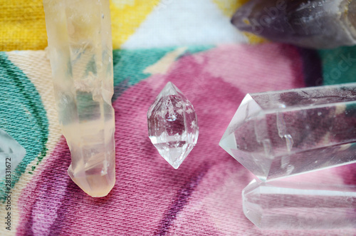 Bright, healing crystals assortment, crystal collection displayed. Mystical, low exposure macro photo of crystals. Healing stones, witchy decoration. Wiccan alter, bohemian colors, crystal witchcraft.