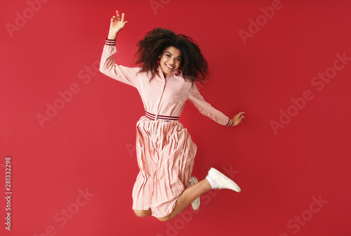 Portrait of jumping African...
