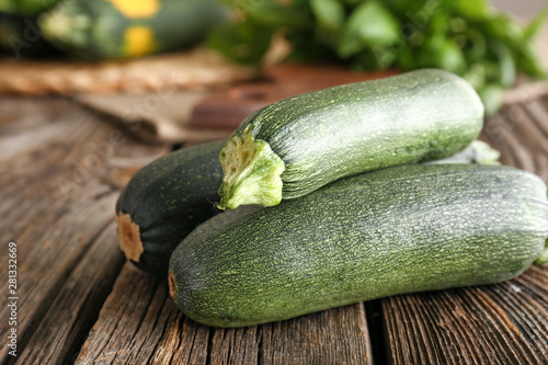 Fresh zucchini on wooden table