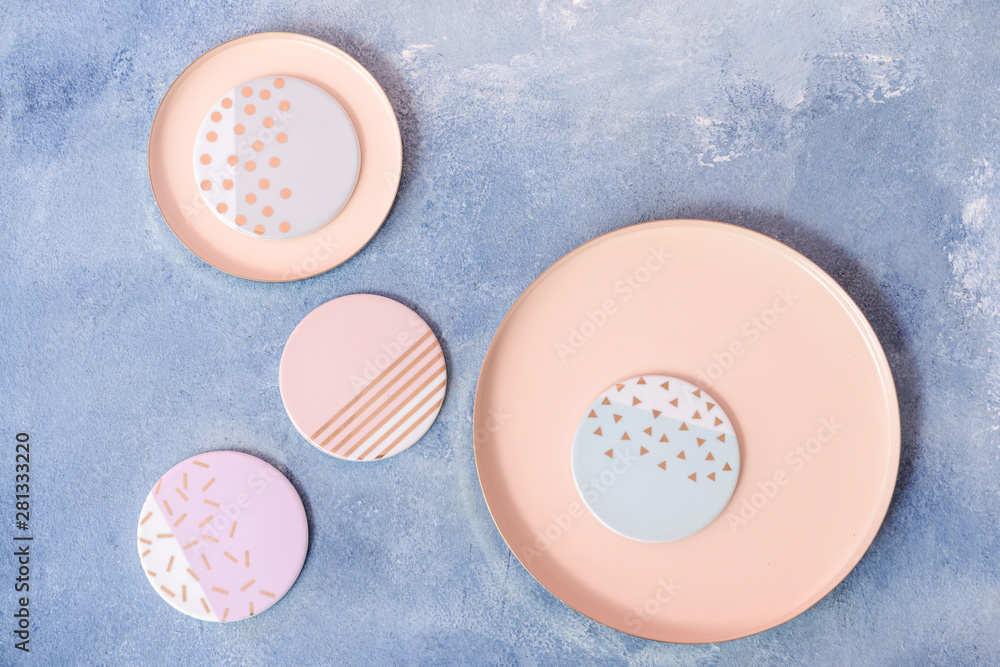 Stylish plates on color background Stylish plates on color background