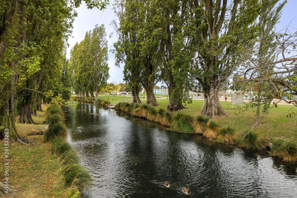 Tree lined river in Christchurch, New Zealand Tree lined river in Christchurch, New Zealand