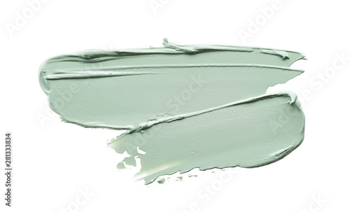 Gently green strokes and texture of face cream or acrylic paint isolated on white background