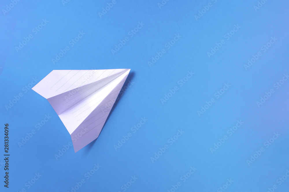 white airplane on a blue background white airplane on a blue background