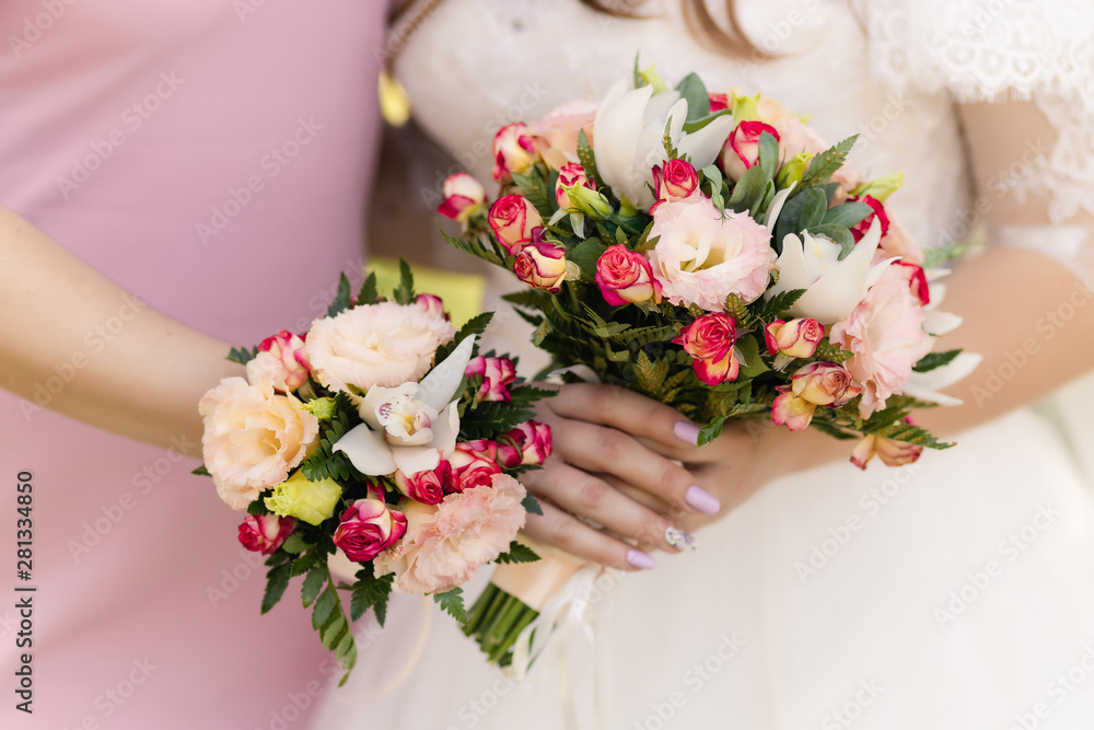  the bride holds a beautiful wedding bouquet