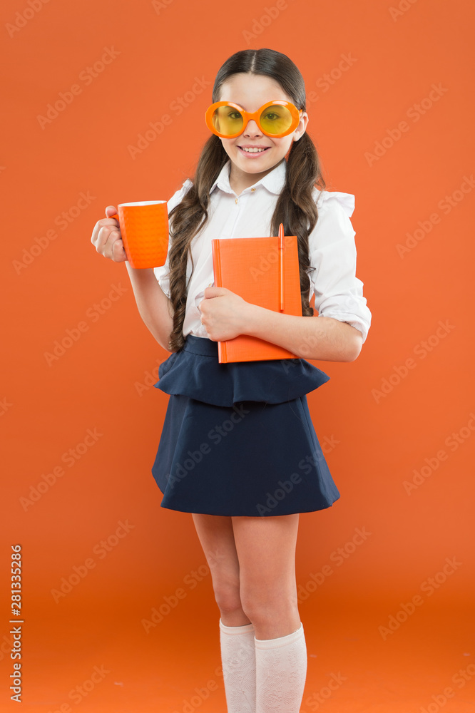 lunch time. happy school girl in uniform and party glasses. small child with notebook. reading education. writing in workbook. children literature. get information from book. kid reporter drink tea lunch time. happy school girl in uniform and party glasses. small child with notebook. reading education. writing in workbook. children literature. get information from book. kid reporter drink tea