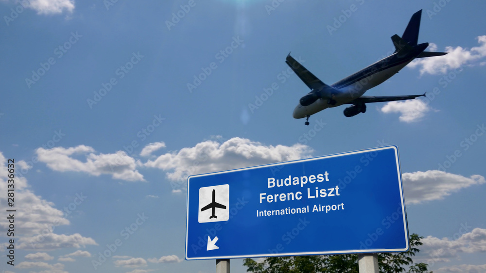 Naklejka premium Plane landing in Budapest Ferenc Liszt with signboard