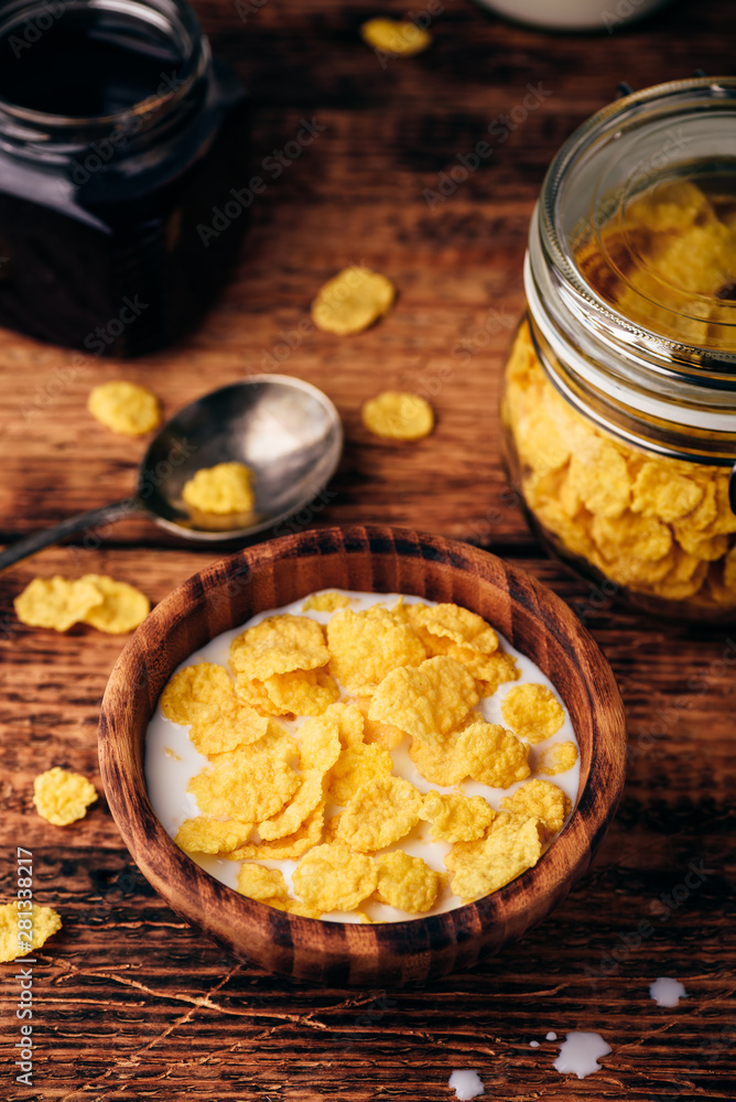 Breakfast with corn flakes, milk and berry syrup Breakfast with corn flakes, milk and berry syrup