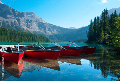 Canoes near the shore of Emerald Lake in Yoho National Park, Canada.