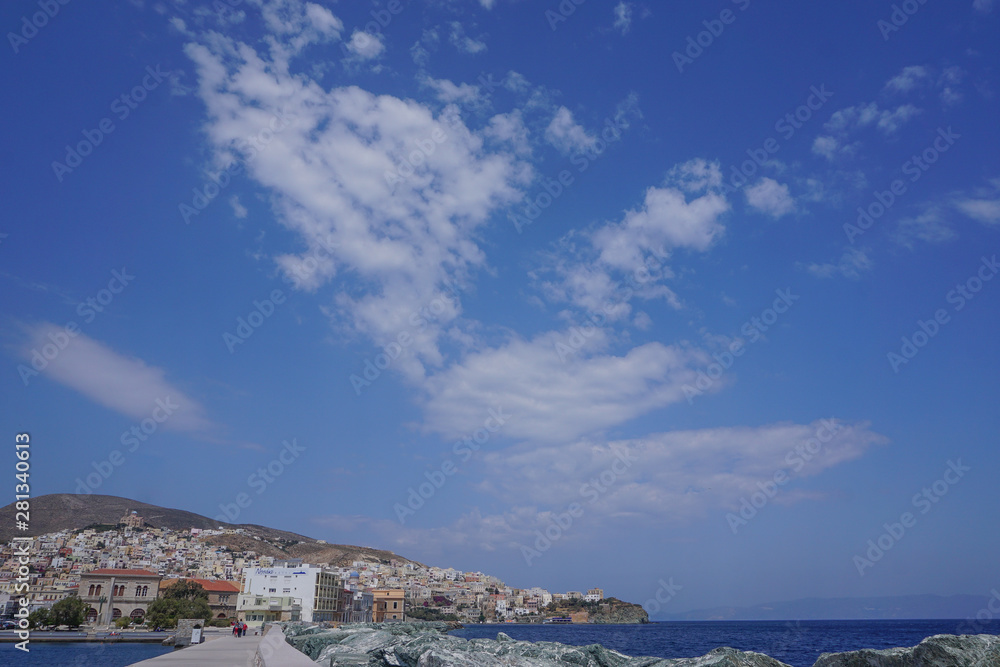 Hermoupolis, Syros, Greece: View from the breakwater of a cloud formation over the coast of Syros, a Cyclades Island in Greece. Hermoupolis, Syros, Greece: View from the breakwater of a cloud formation over the coast of Syros, a Cyclades Island in Greece.