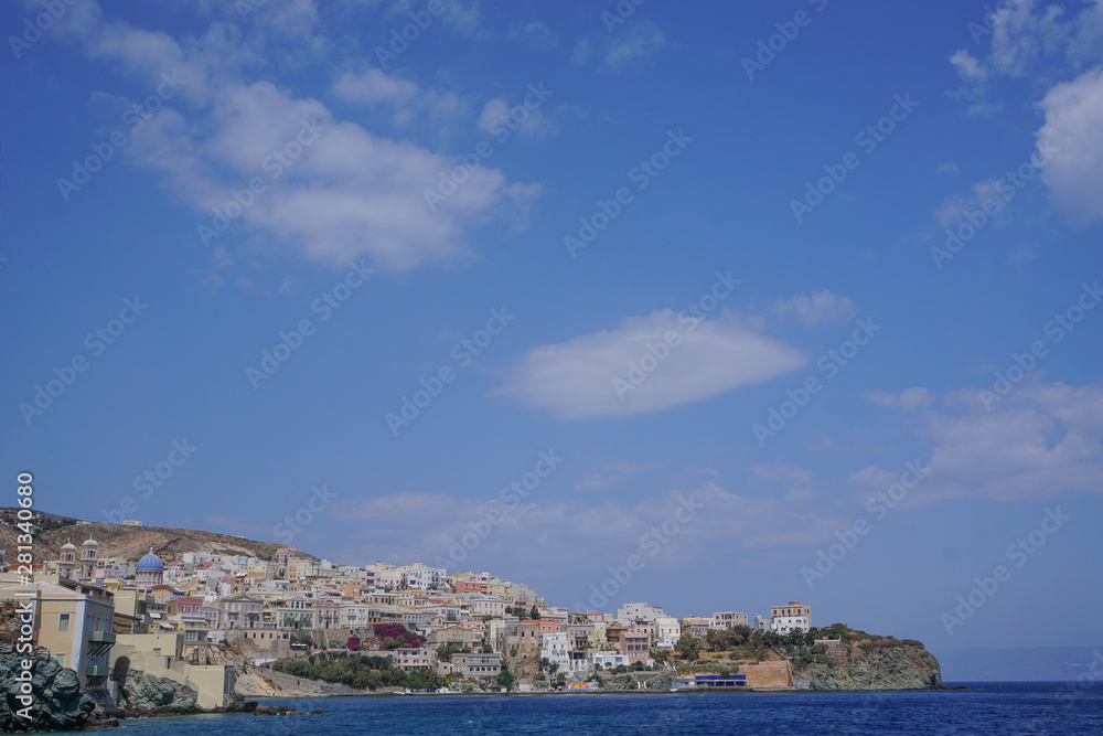 Hermoupolis, Syros, Greece: View from the breakwater of a cloud formation over the coast of Syros, a Cyclades Island in Greece.