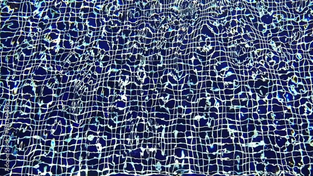 Close-up Shot Of Pool Water features a close-up shot of the clear blue waters of a swimming pool. It appears like the video was taken on a sunny day and the pool looks clean and soothing. Close-up Shot Of Pool Water features a close-up shot of the clear blue waters of a swimming pool. It appears like the video was taken on a sunny day and the pool looks clean and soothing.