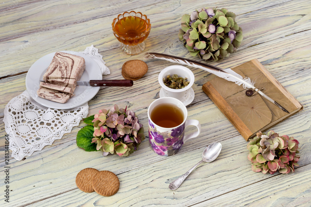 Herbal tea and confection on a wooden table