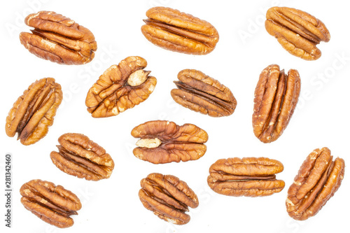 Lot of whole fresh brown pecan nut half flatlay isolated on white background