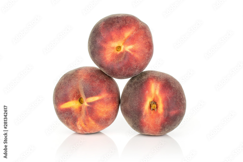 Group of three whole fresh red peach arranged in a pyramid isolated on white background