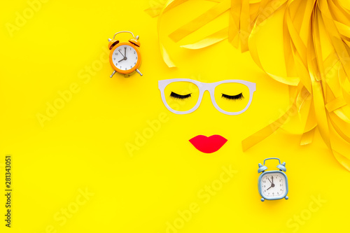 Make up concept with face model for visagiste work on yellow background top view mock-up photo