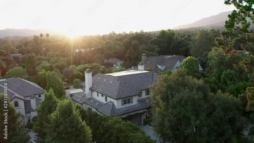Flight over wealthy neighborhood in American city suburb, aerial view