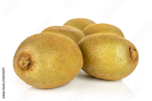 Group of five whole fresh green kiwifruit actinidia deliciosa layered from the front to the back isolated on white background