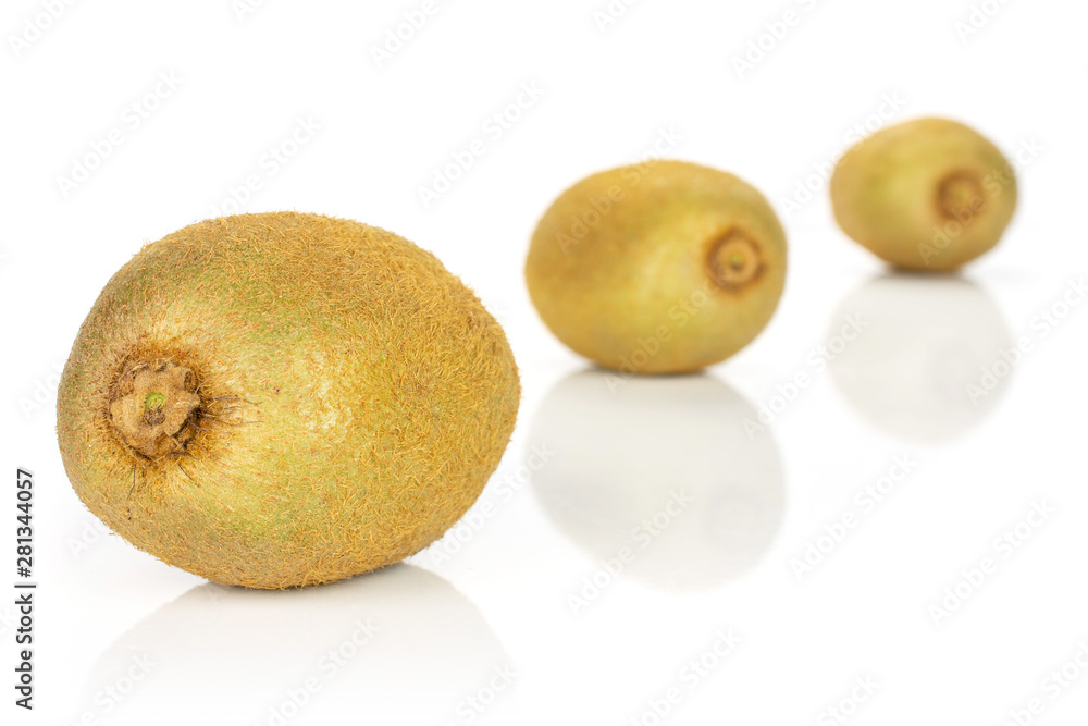 Group of three whole fresh green kiwifruit actinidia deliciosa placed diagonally in a line isolated on white background Group of three whole fresh green kiwifruit actinidia deliciosa placed diagonally in a line isolated on white background