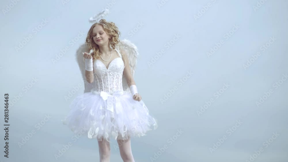 Lovely child. Valentines day card. Little girl with angel wings and halo. A beautiful teen with blonde curly hair and a bow and arrow as cupid - Valentines Day. Arrow of love Lovely child. Valentines day card. Little girl with angel wings and halo. A beautiful teen with blonde curly hair and a bow and arrow as cupid - Valentines Day. Arrow of love
