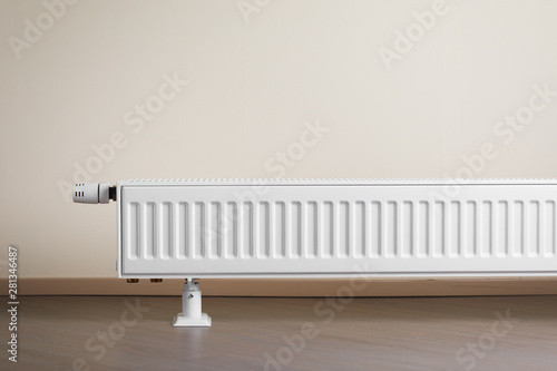 Wallpaper Mural heating radiator with thermostatic knob in the living room Torontodigital.ca