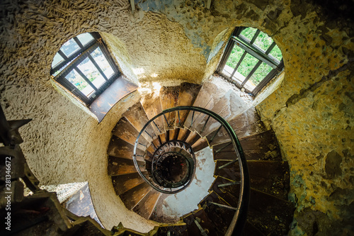 Old spiral staircase in abandoned mansion, upside view
