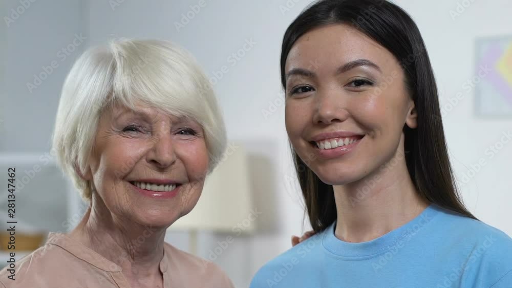 Happy young and senior ladies looking to camera and smiling, family generations Happy young and senior ladies looking to camera and smiling, family generations