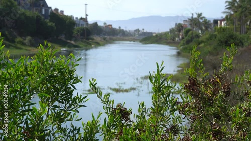 Beautiful view of Marina del Rey lagoon. Channel with ocean water. Private houses on both sides of shore. Warm Sunny Day in Los Angeles California.