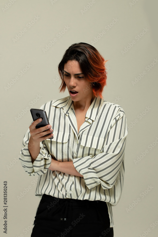 woman surprise and angry holding a smartphone woman surprise and angry holding a smartphone