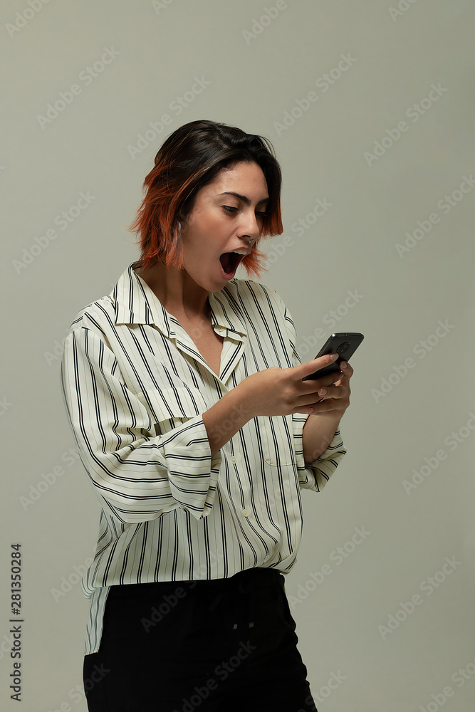 woman surprise and angry holding a smartphone woman surprise and angry holding a smartphone