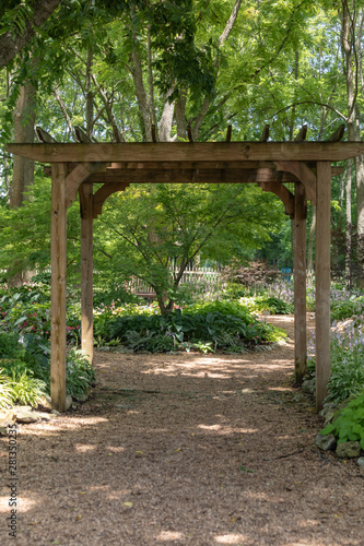 Pergola in a garden with a path