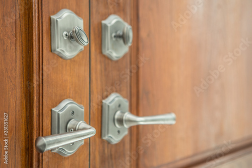 Selective focus of Luxury door handles on wooden door